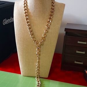 Gold tone curb link Y necklace